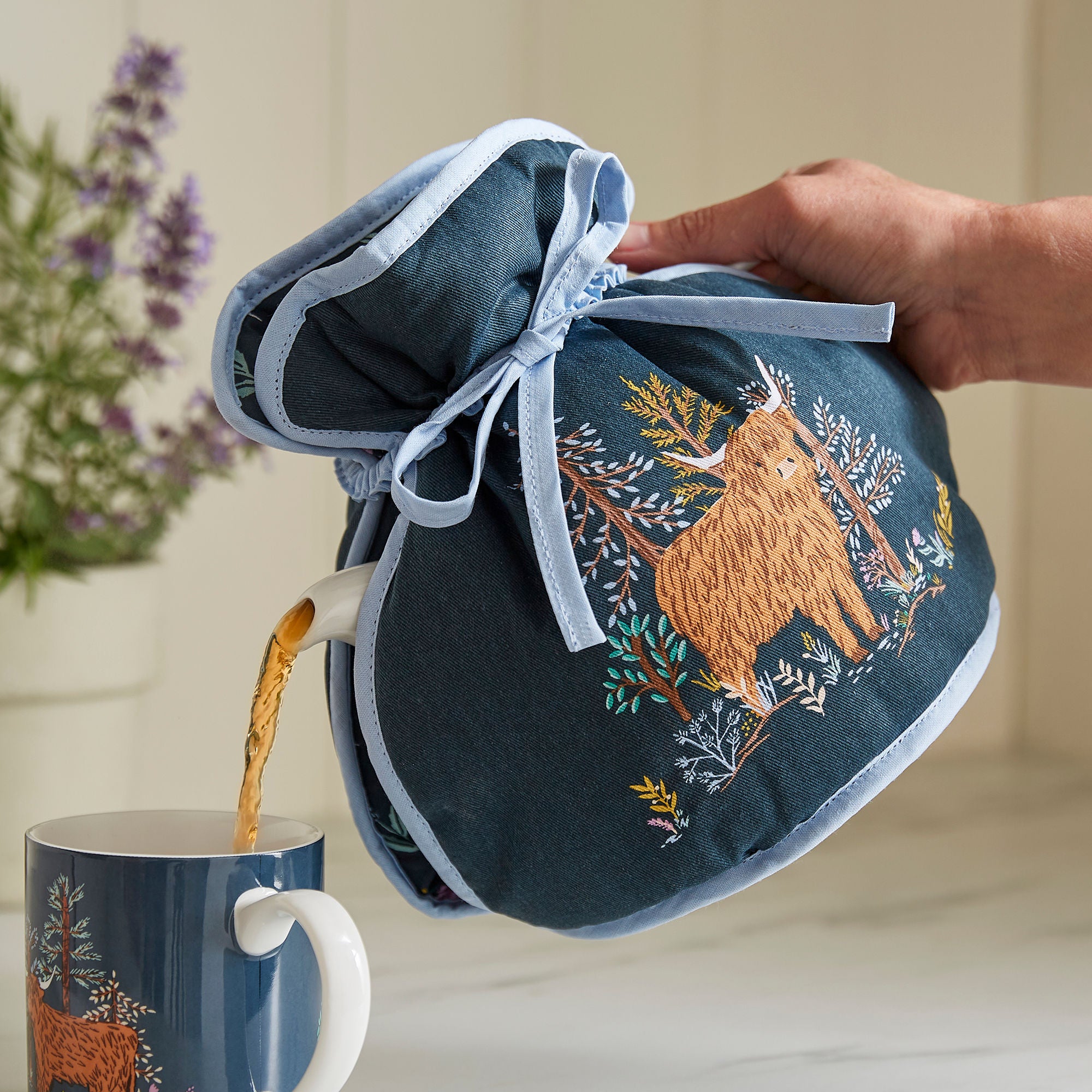 ulster-weavers-connie-the-cow-teew-rmer-muff-in-navy image 2