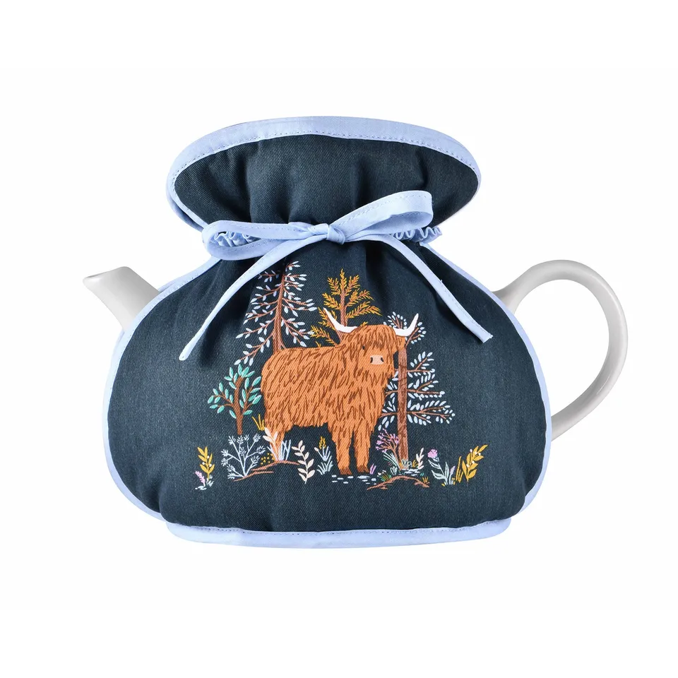 ulster-weavers-connie-the-cow-teew-rmer-muff-in-navy image 1